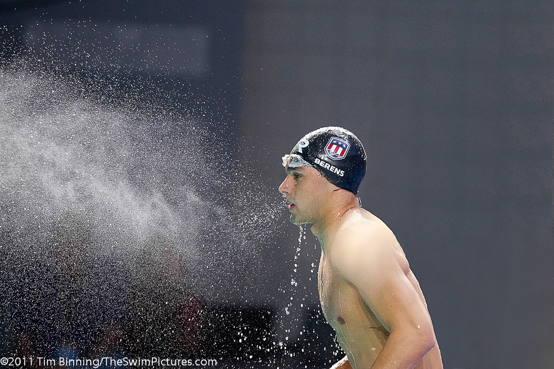Ricky Berens of the USA spews a watery mist before the 100m Fly start at the 2011 Mutual of Omaha Duel in the Pool held December 16 and 17, 2011 at Georgia Tech University in Atlanta, Georgia.