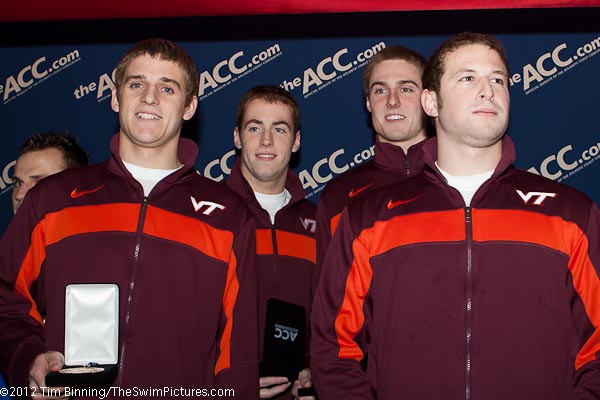 The Virginia tech 200 medley relay squad of Charlie Higgins, Emmett Dignian, Greg Mahon and Greg Morgan capture the opening event of the 2012 ACC Men's Swimming and Diving Championships being held at the Christiansburg Aquatic Center which is home to the Virginia Tech Swimming and Diving program.