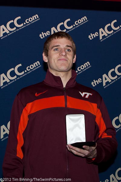 Virginia Tech Junior Greg Mahon wins the 100 fly in 46.55 with teammate Karl Botha taking third.