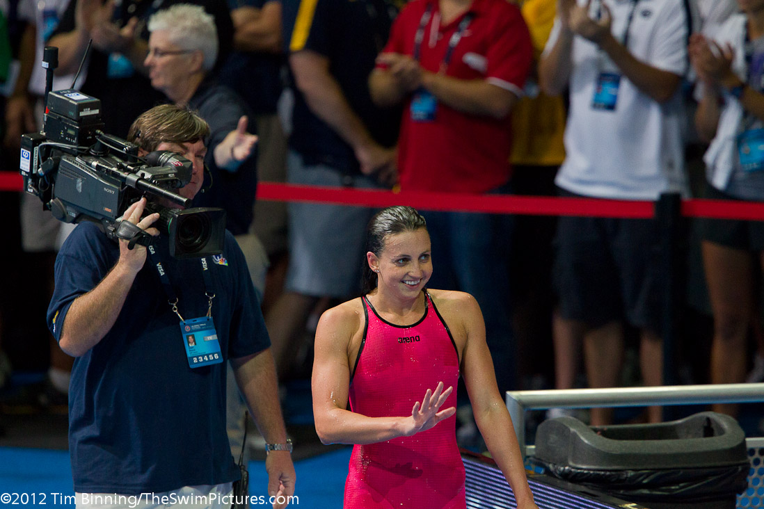 Rebecca Soni of Trojan Swim Club waves to the crowd after winning the 200 breast final.