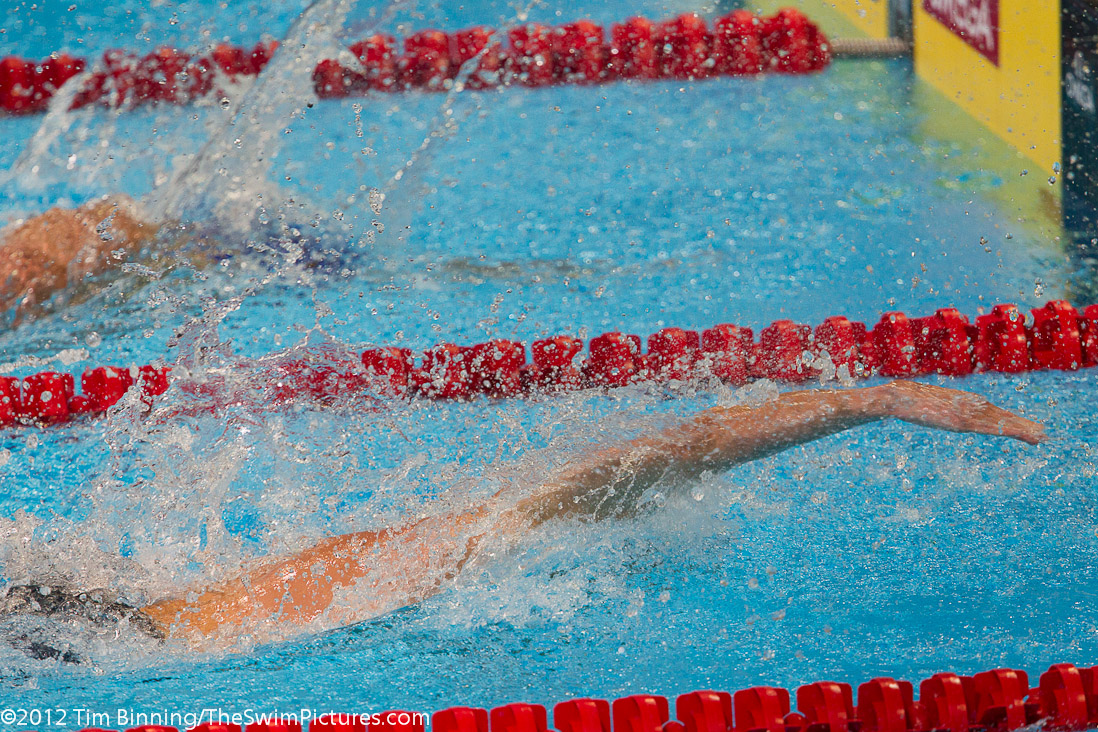Michael Phelps (nearest) reaches for the wall and out touches Ryan Lochte in the 200 IM final.