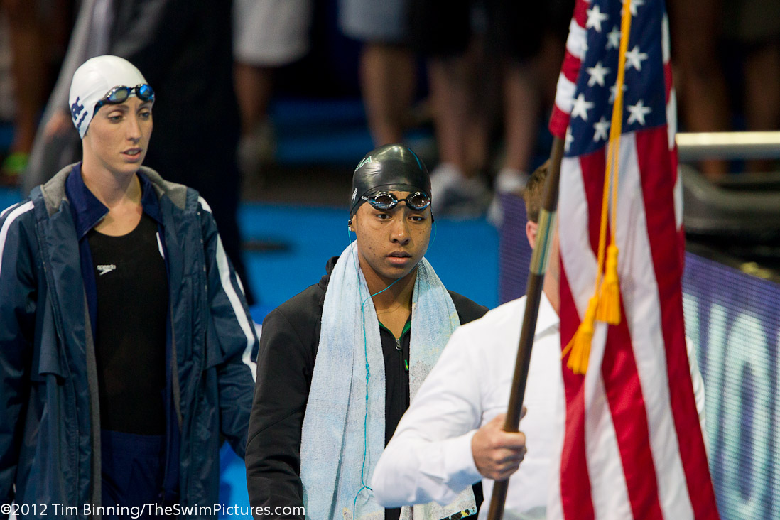 Lia Neal of Asphalt Green parades to the starting blocks before the start of the 100 free final.