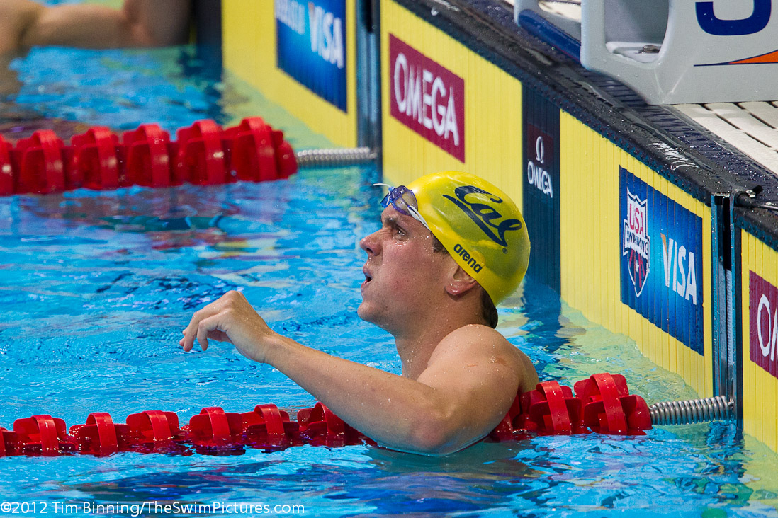 Tom Shields of Cal Aquatics checks his time in the 100 fly semi-finals.